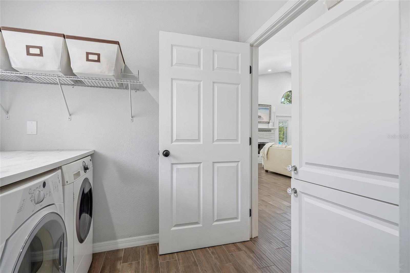 Interior laundry room with door to separate from the main areas of the home.