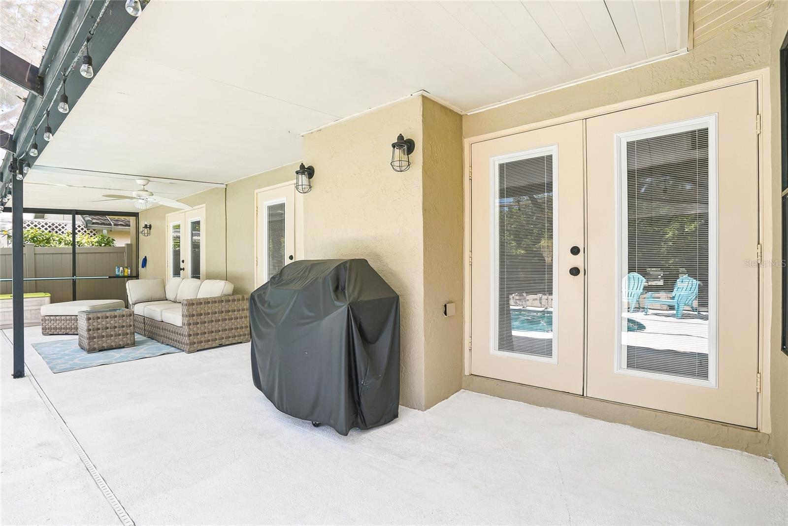 French doors lead to both the primary suite and the living room.