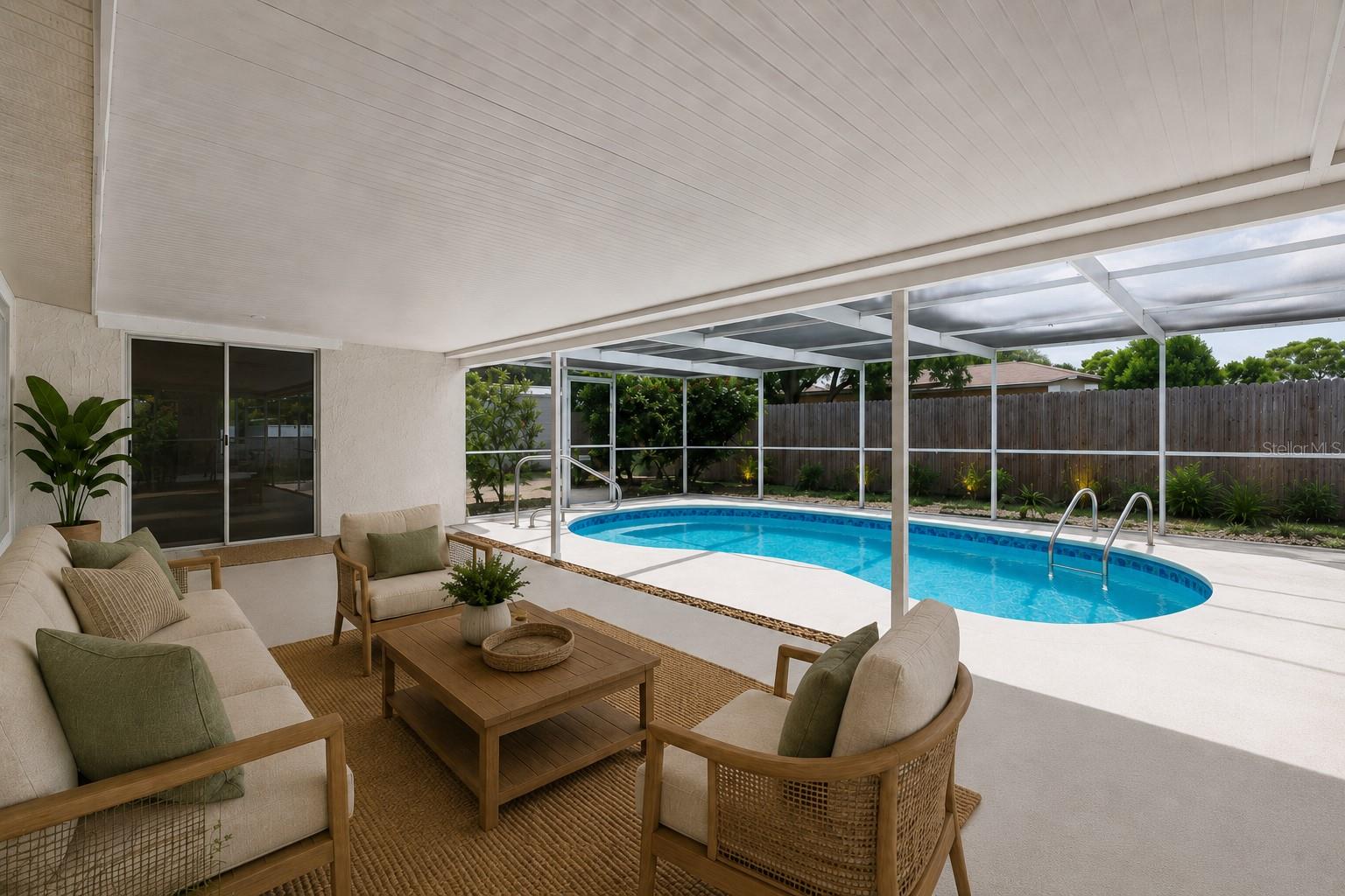 Covered screen in patio by pool staged