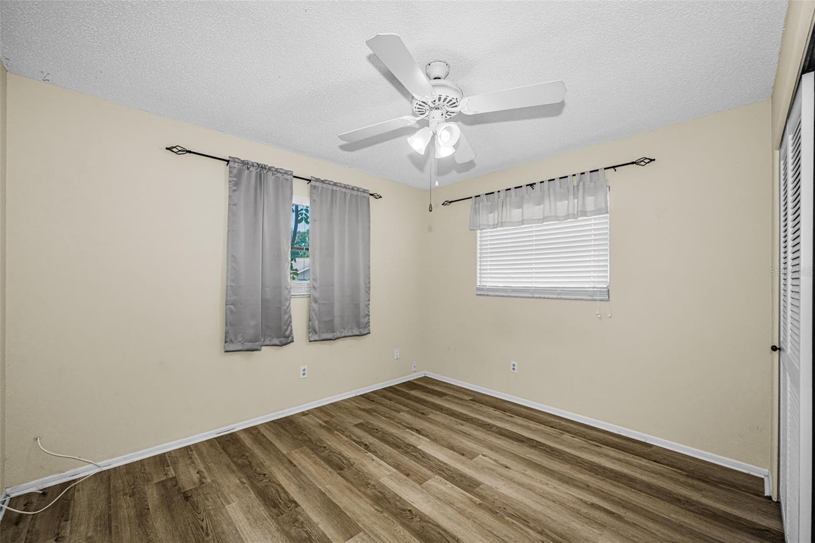 Bedroom with laminate floors