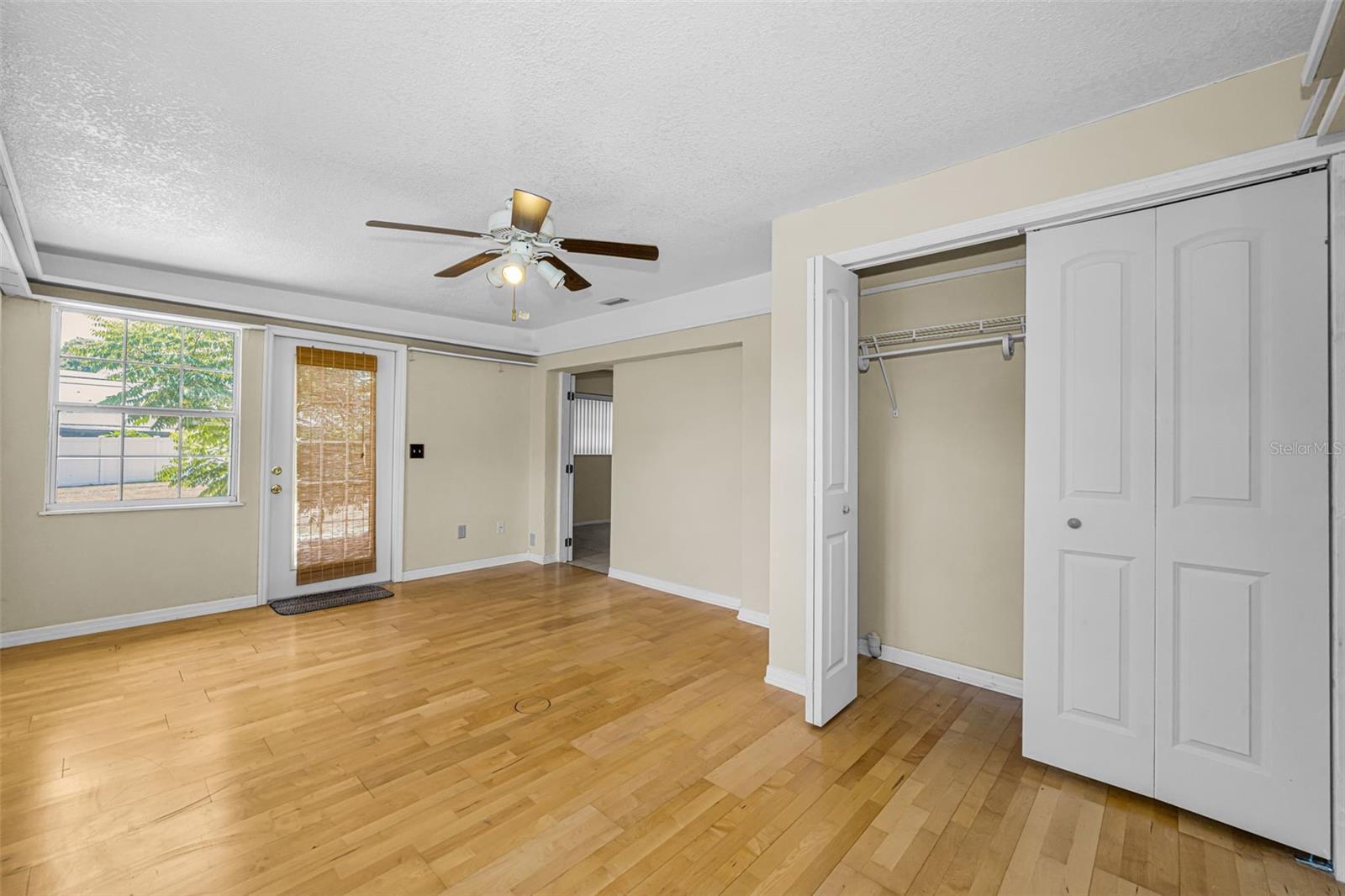 This bedroom could be an office, or mother-in-law suite since it has a private entrance.