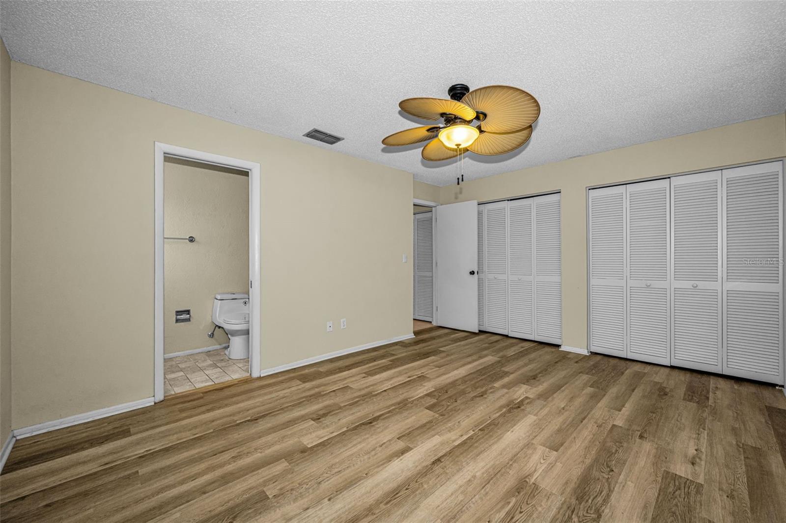 Master Bedroom with 2 wall closets & laminate floors