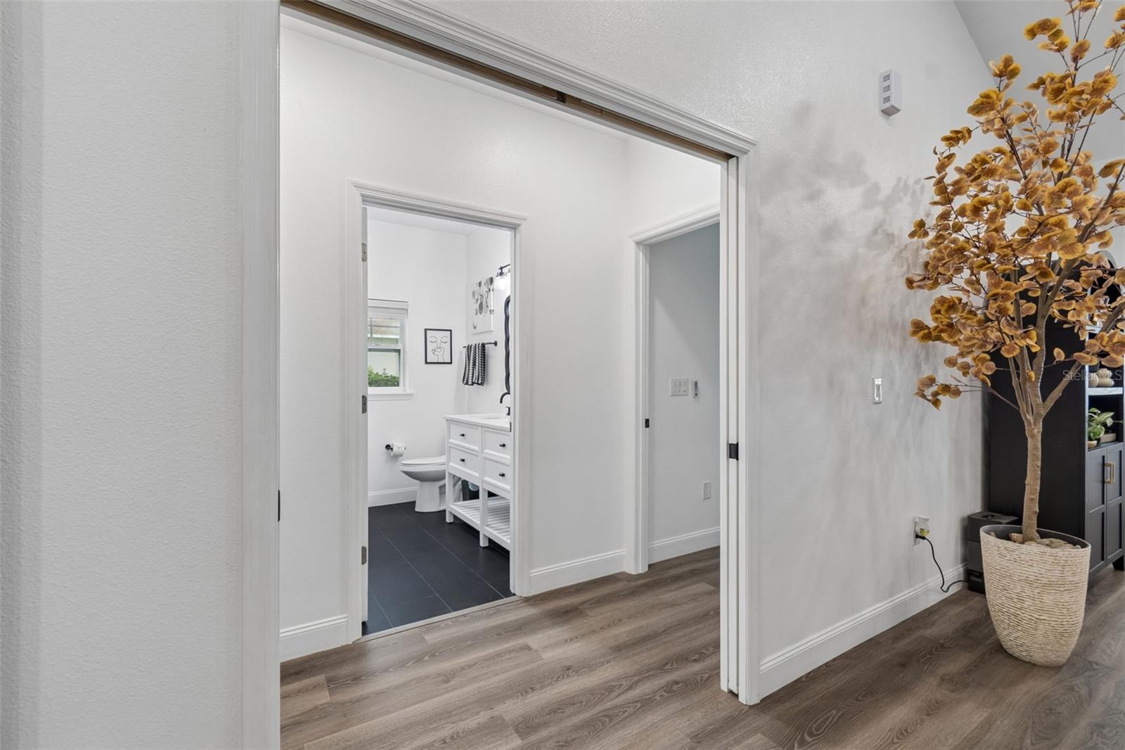 Hall to bedrooms 2&3 with pocket doors