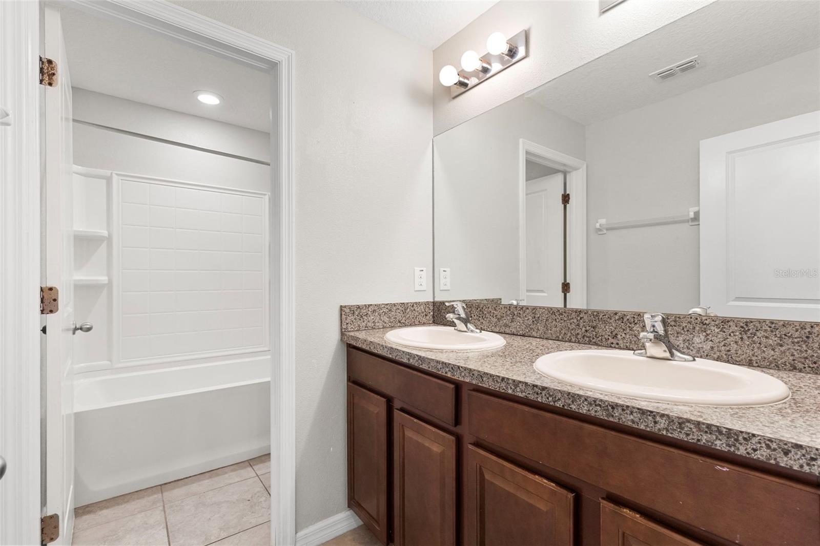 Upstairs bathroom with door to WC and Tub/Shower
