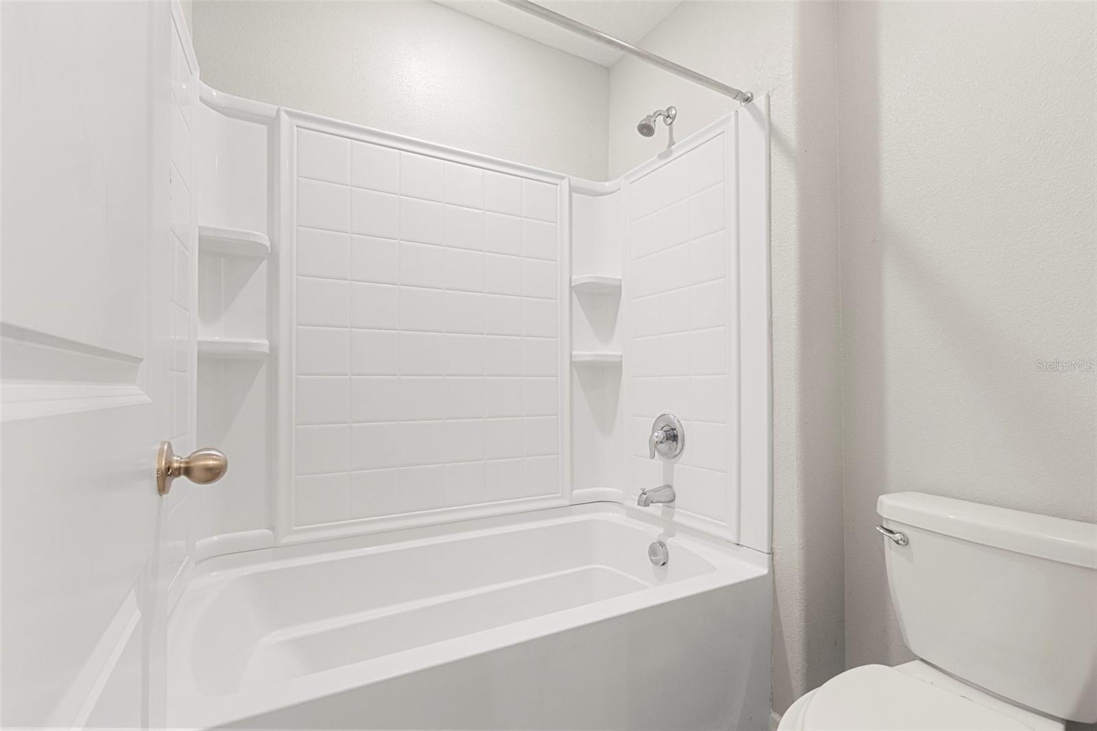 Upstairs bathroom with door to WC and Tub/Shower