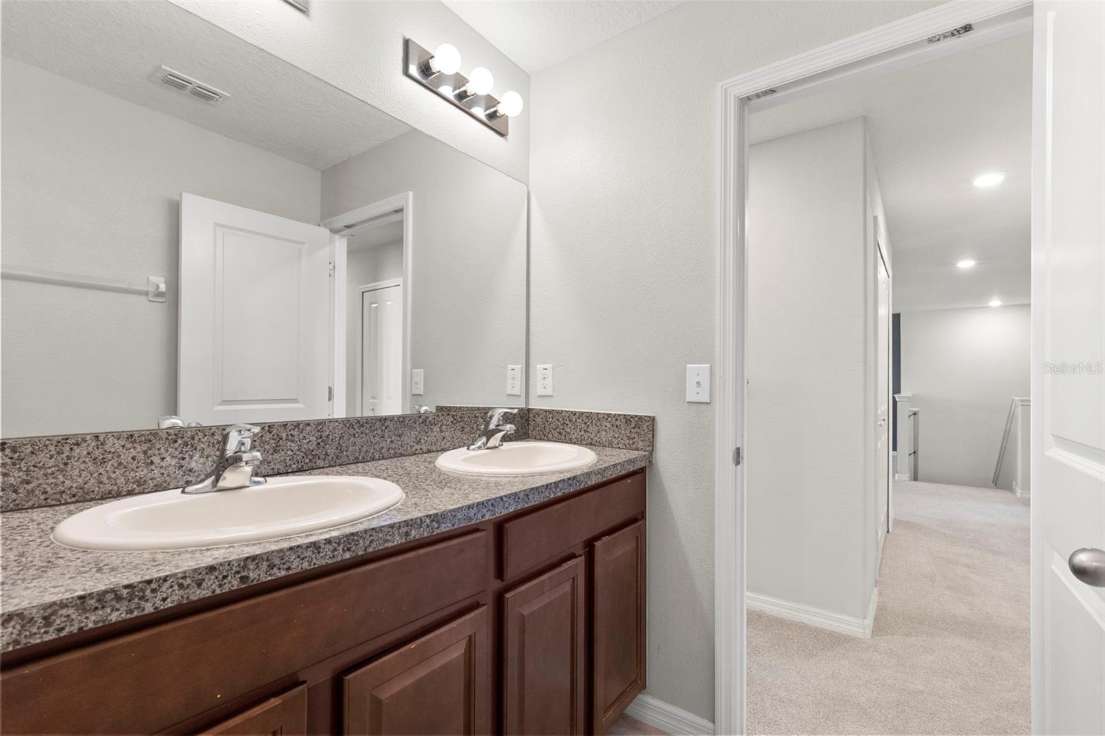 Upstairs bathroom with door to WC and Tub/Shower