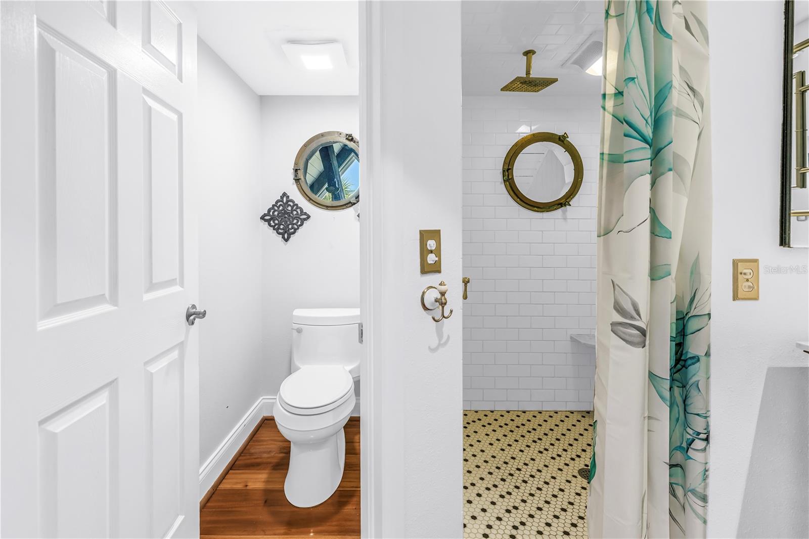 Port hole in bath w/ waterviews