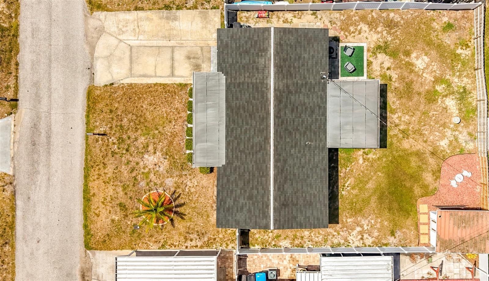 Large fenced in backyard with patio and shed with electric