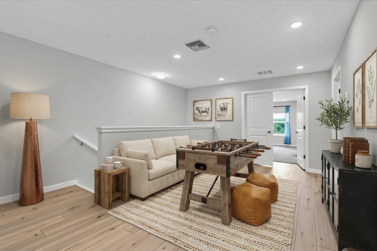 upstairs loft virtual staged as game room
