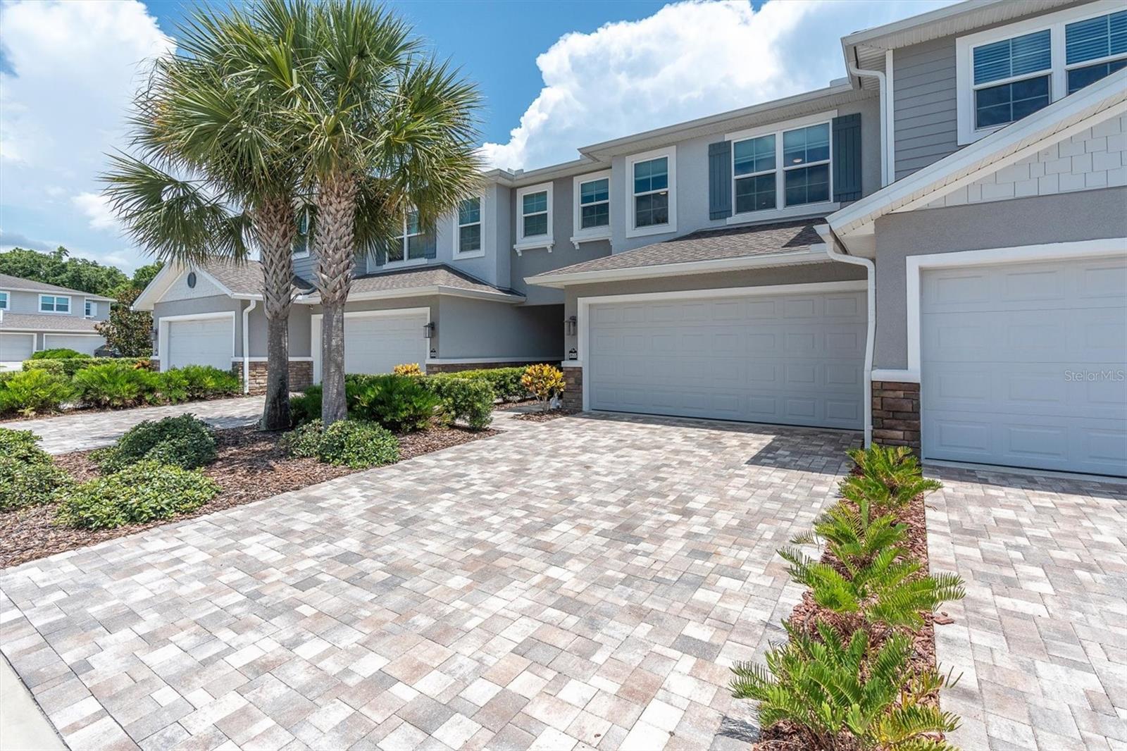 spacious long paver driveway