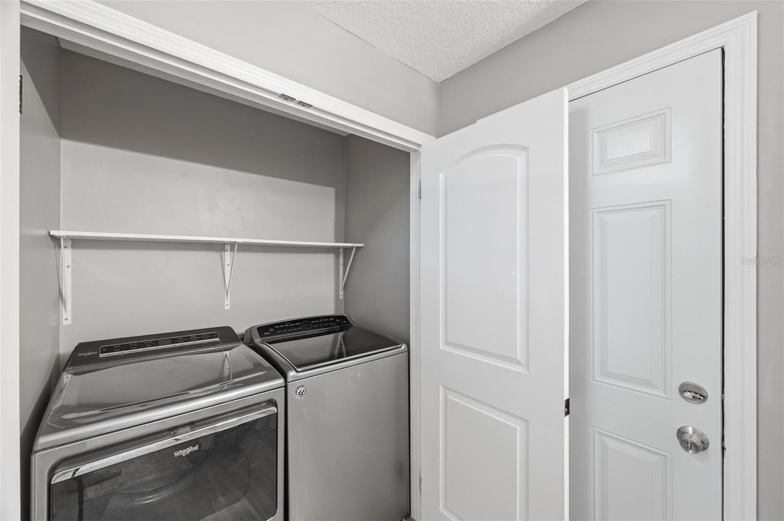 Primary Ensuite - Laundry closet - Door to Lanai/Pool