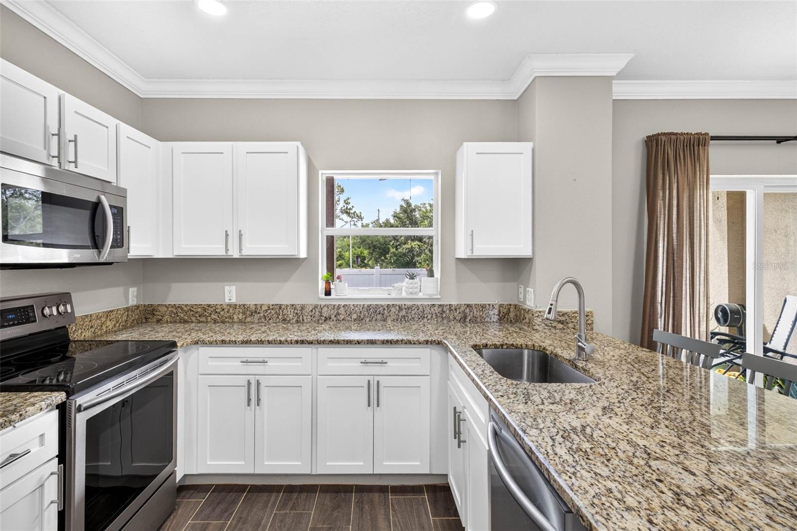 Stainless steel appliances, new cabinets & counters.