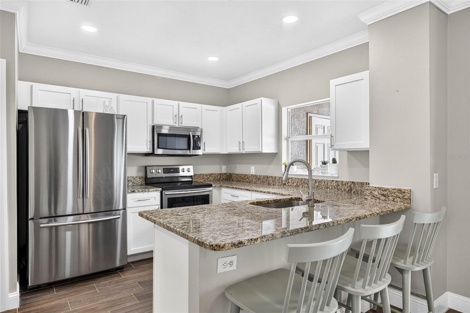 Updated kitchen cabinets, appliances, & countertops.