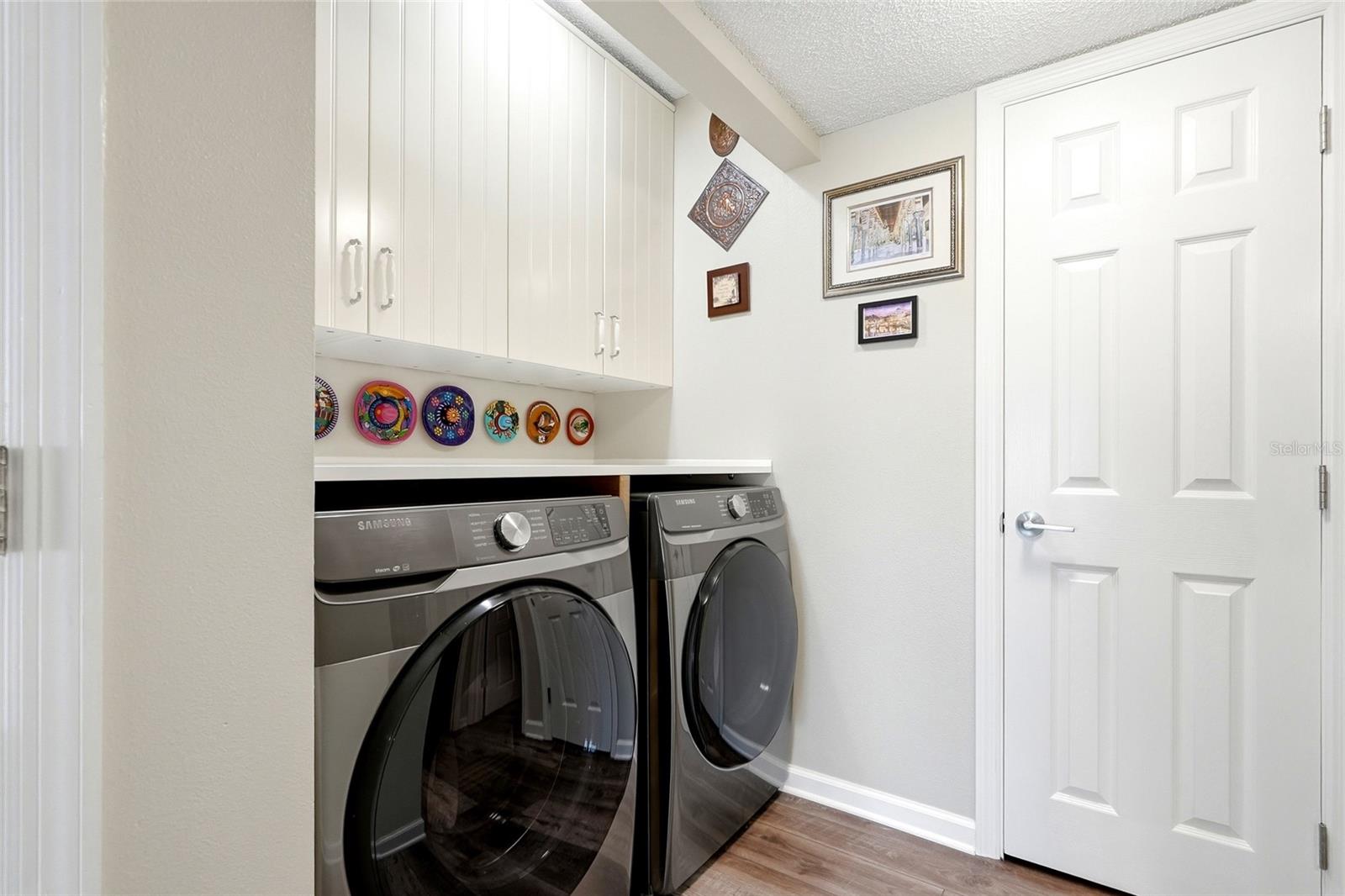 Laundry room with modern washer and dryer