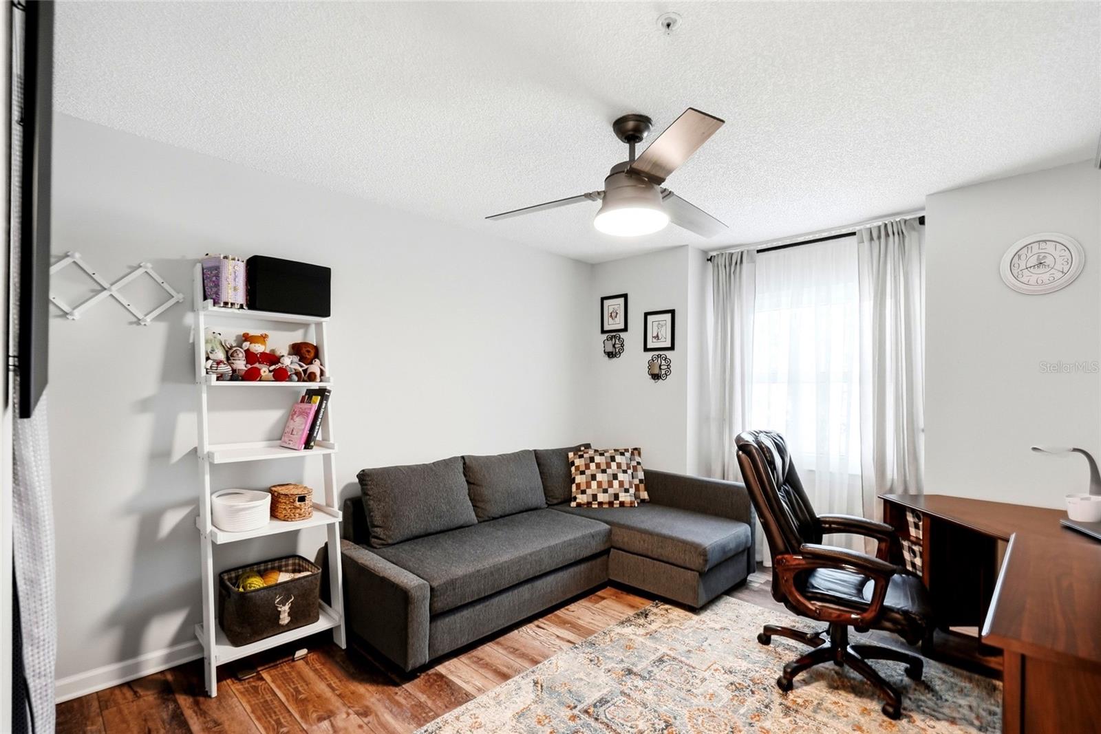 Bright and spacious second bedroom or office with abundant natural light