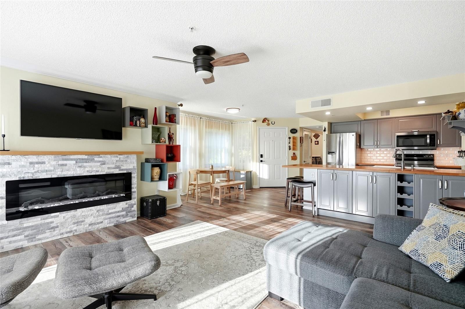 Open-concept living room, dining area, and kitchen.