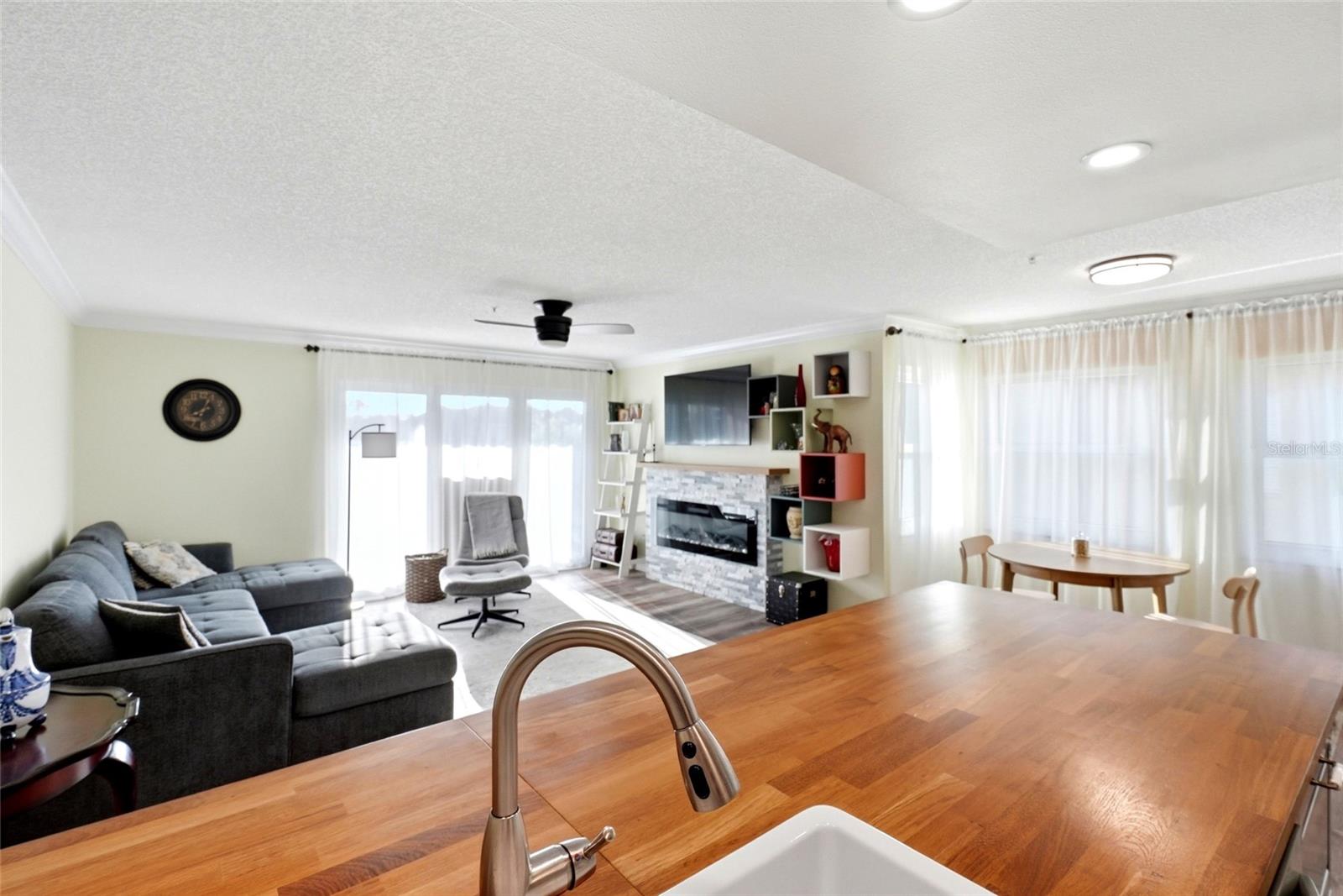 Kitchen with breakfast bar overlooking the living area and balcony