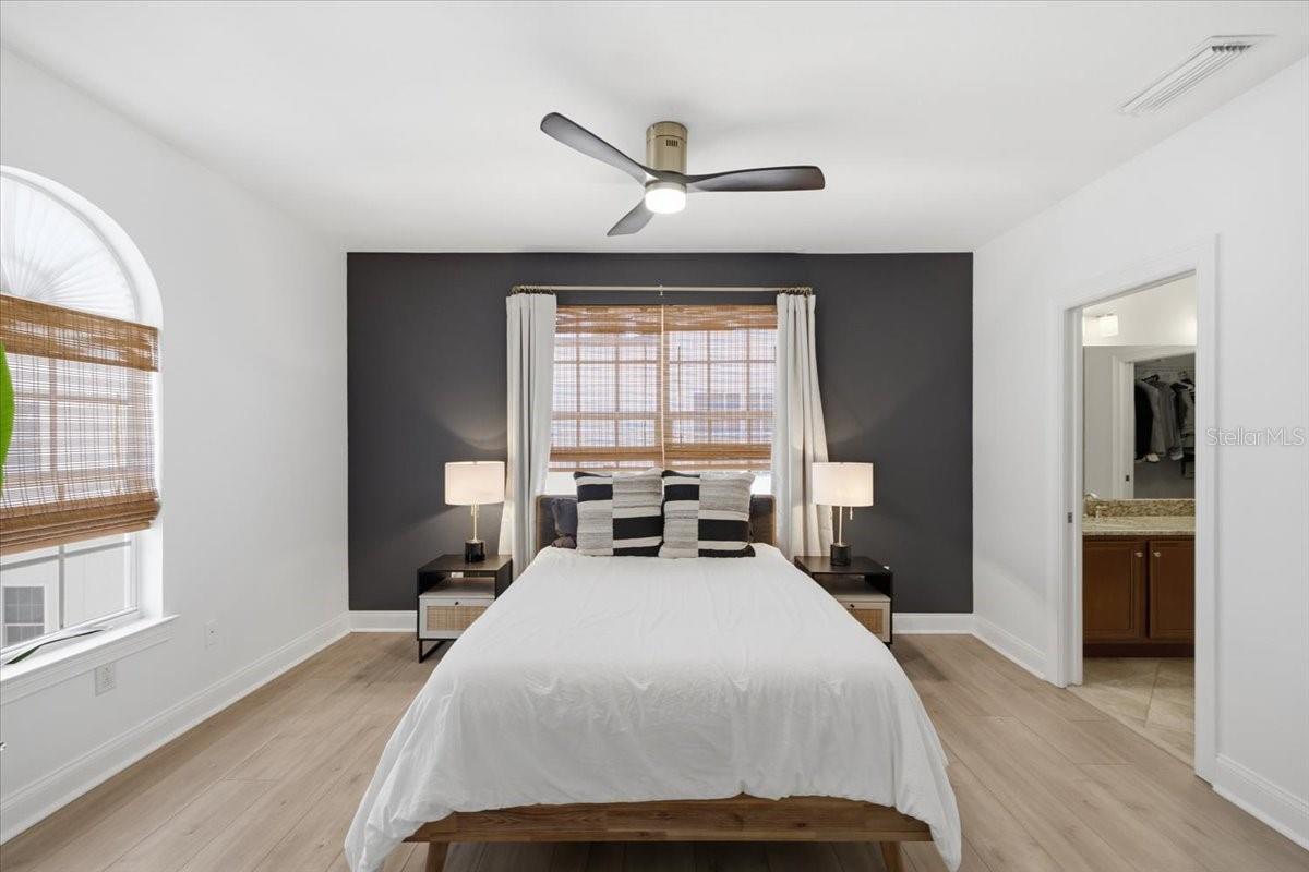 Primary Suite with custom shades and accent paint.