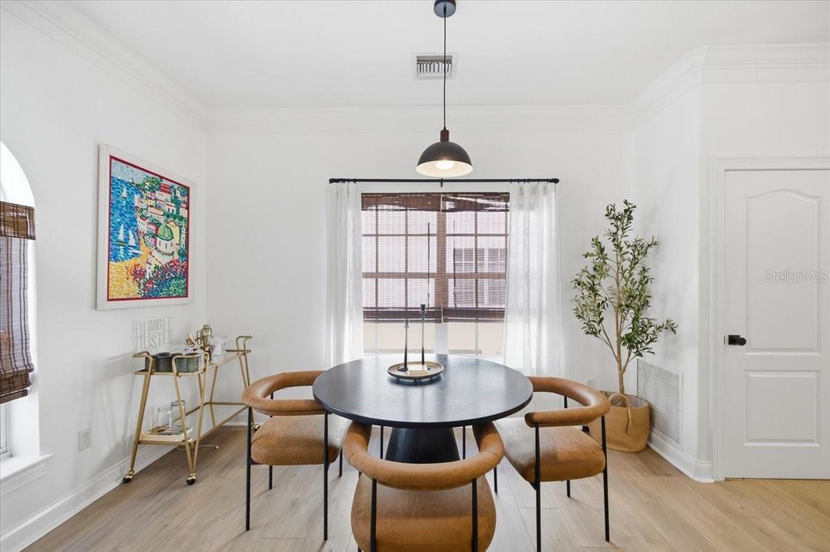 Dining Area with updated lighting and blinds