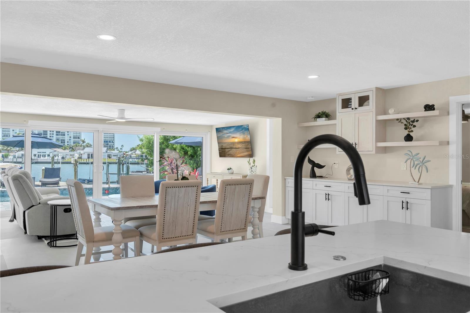 island with breakfast bar and a view