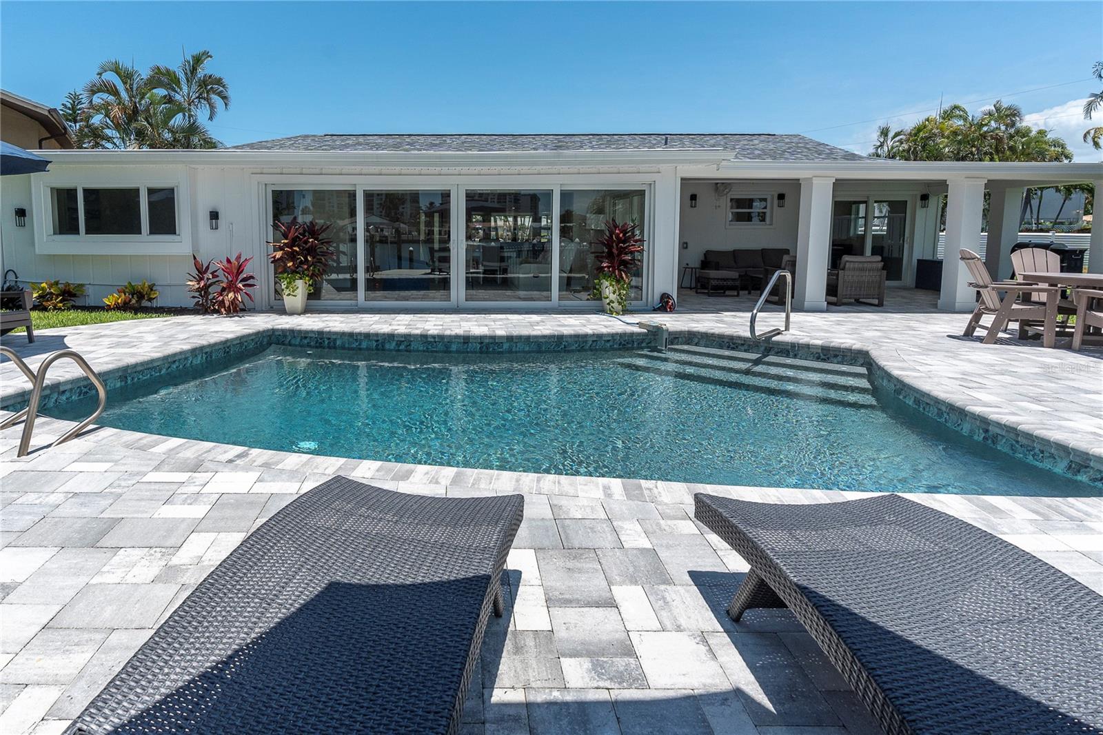 generous pavered pool deck