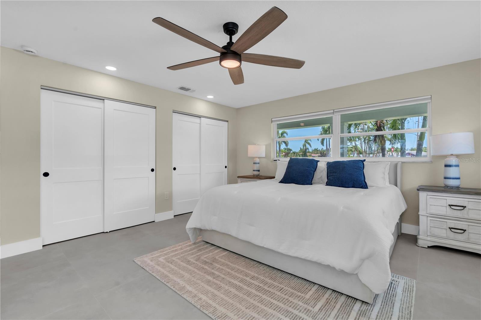 Spacious waterside primary bedroom