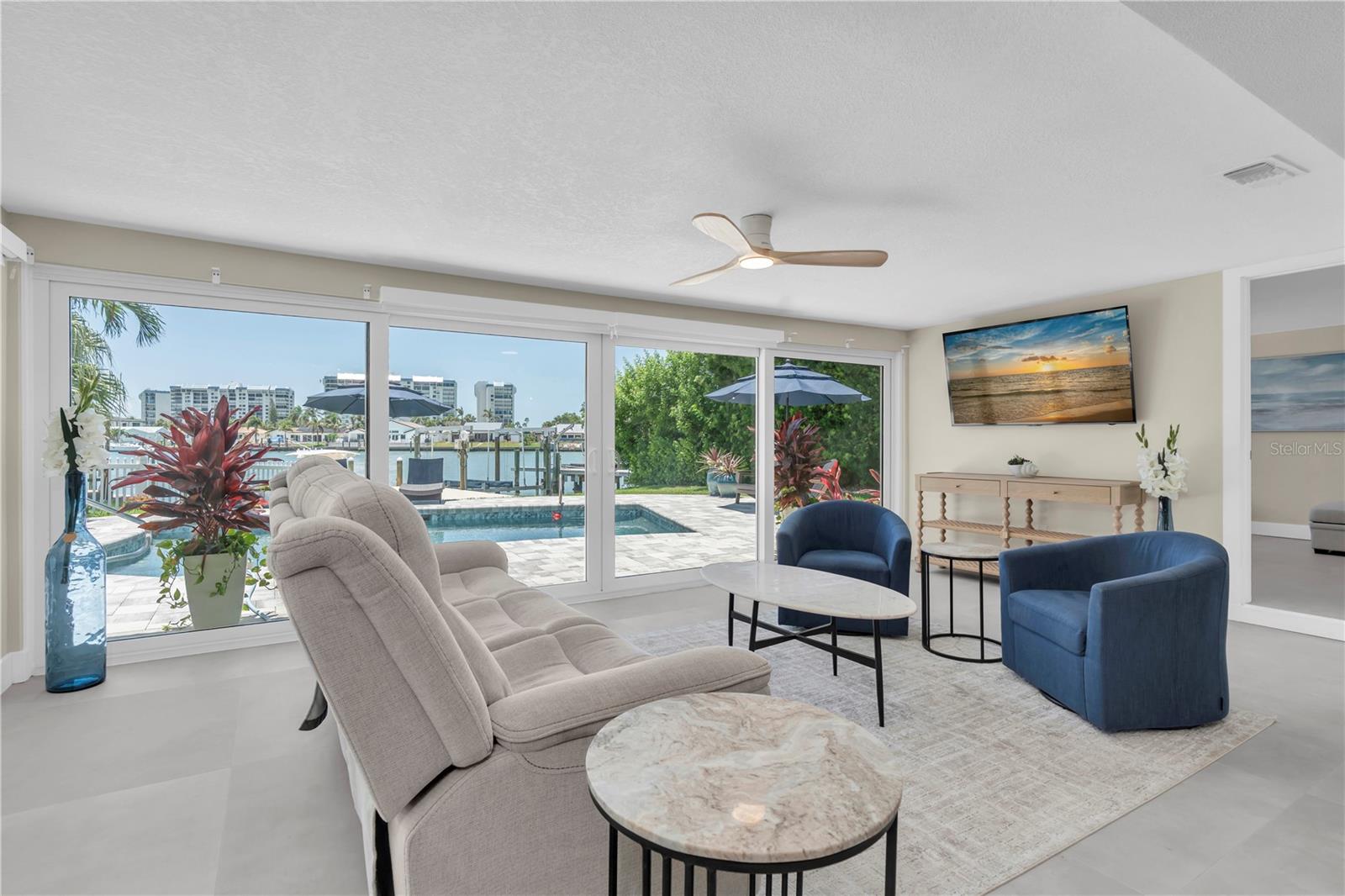 wall to wall sliders and picture windows enhance the open feel and waterfront enjoyment