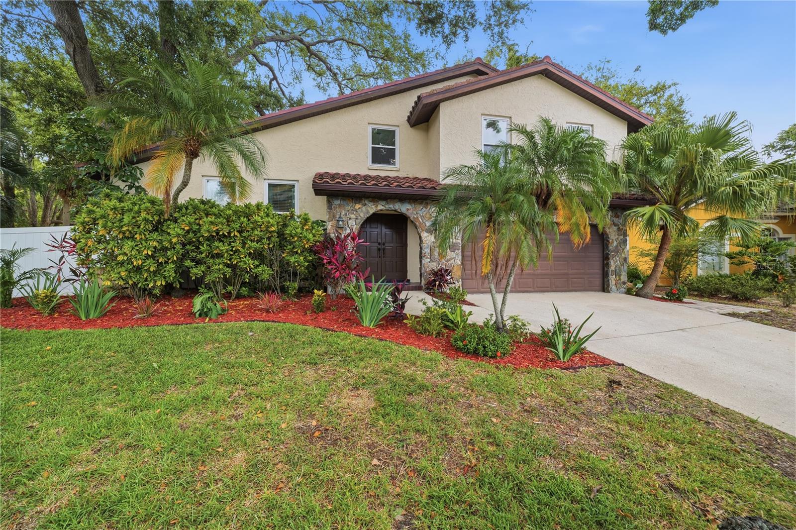 Beautifully landscaped and surrounded by mature trees on a nice cul-de-sac