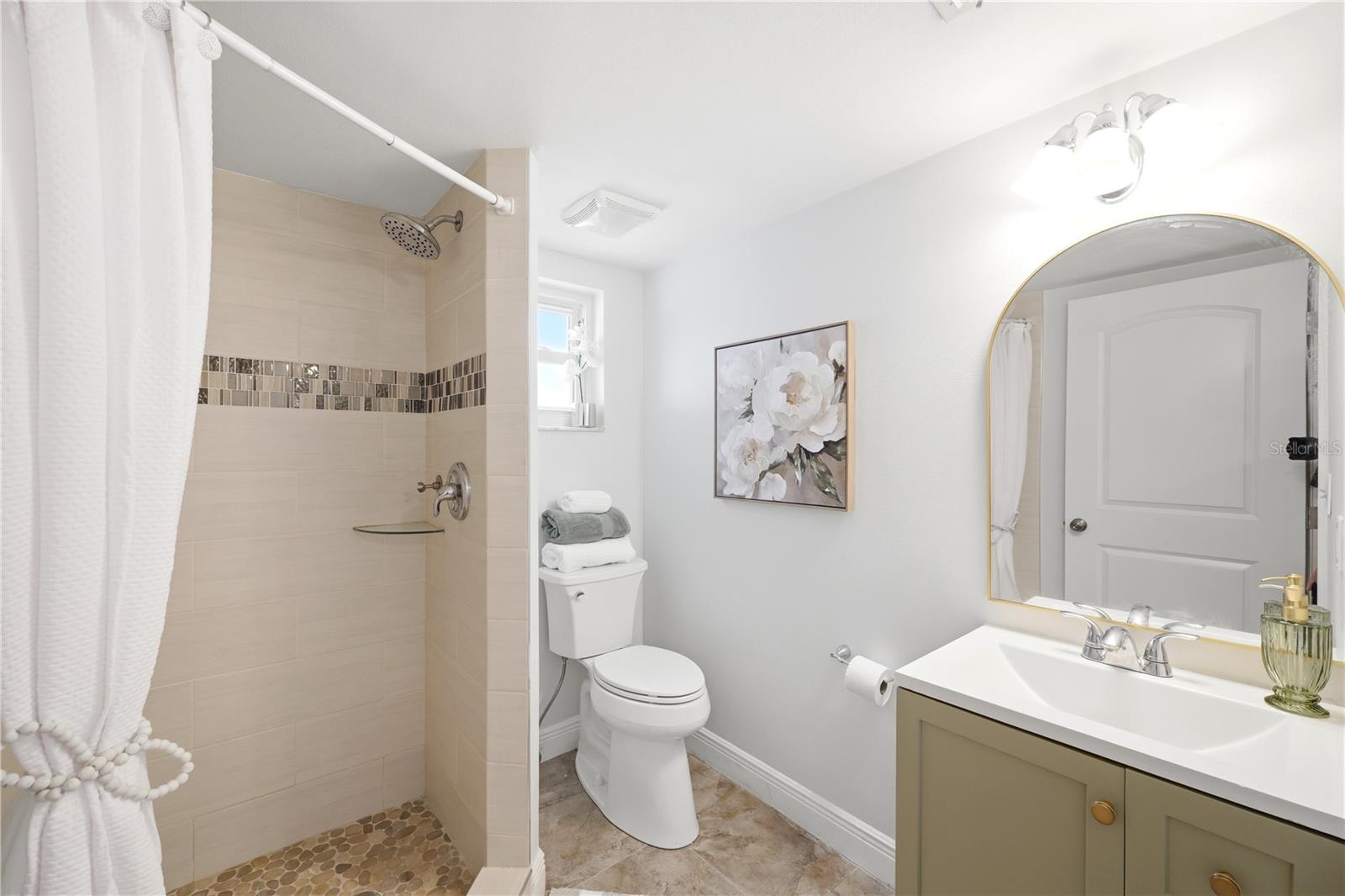 Pool bath on first floor with walk in shower and newly installed toilet