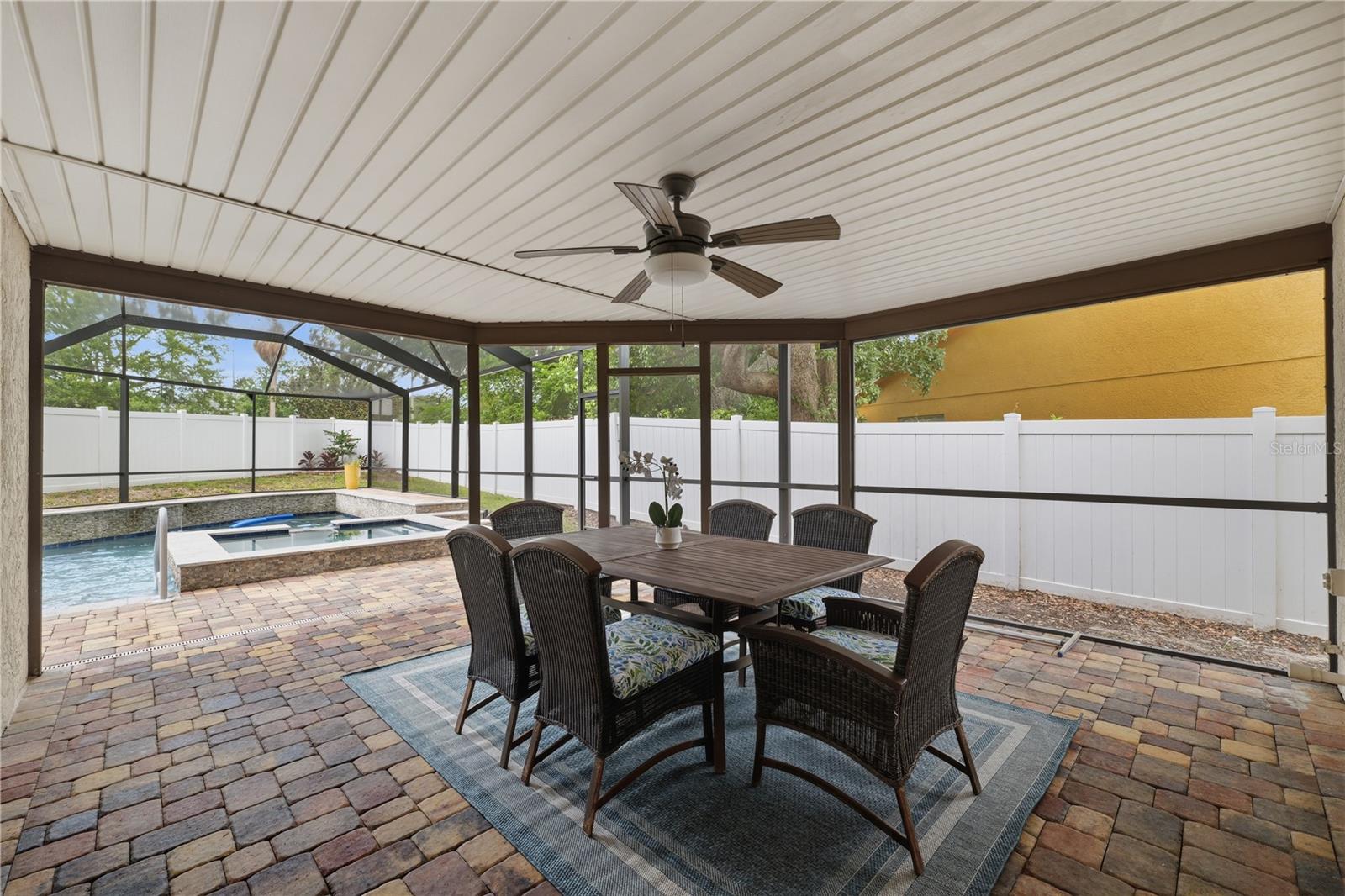 Outdoor dining area overlooking the pool