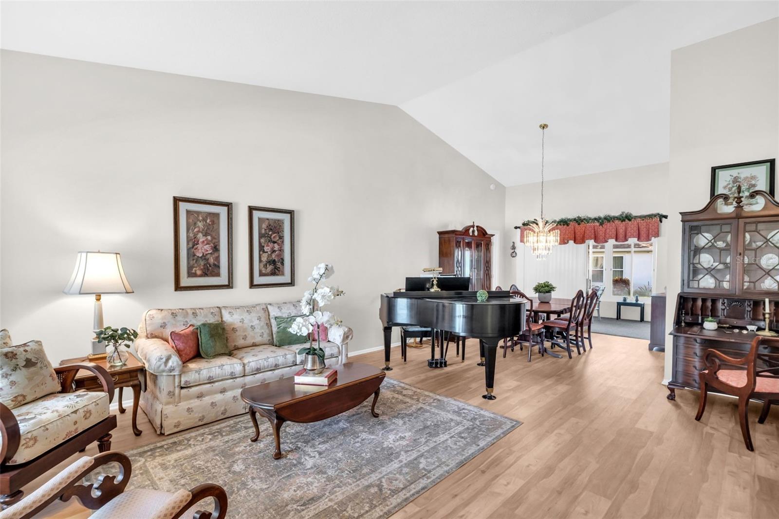 Soaring vaulted ceilings & luxury vinyl plank flooring upon entry~