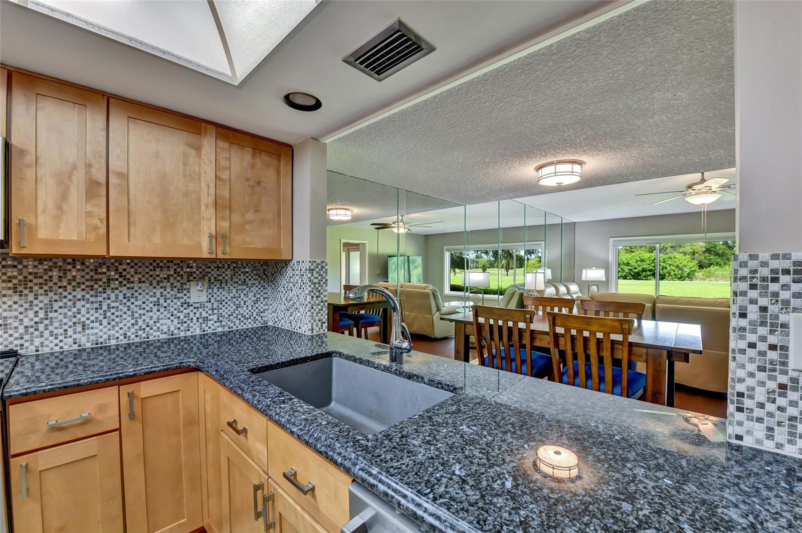 Full wall mirror increases the view from the kitchen