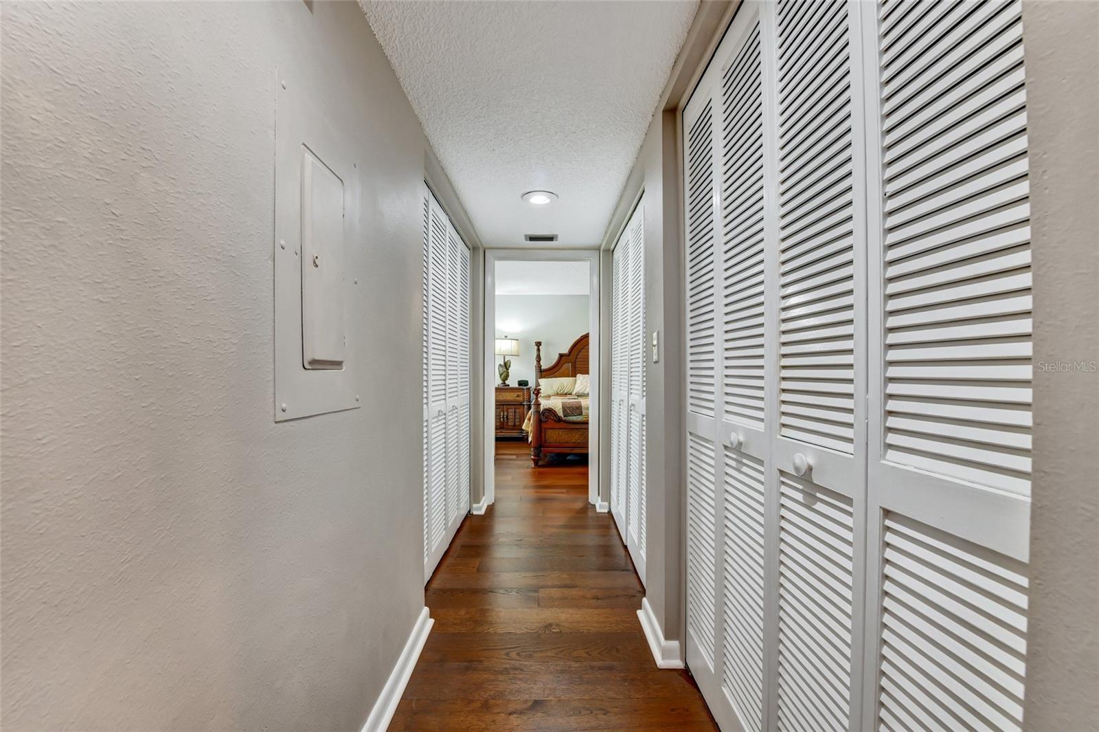 Several closets in hallway to primary bedrrom