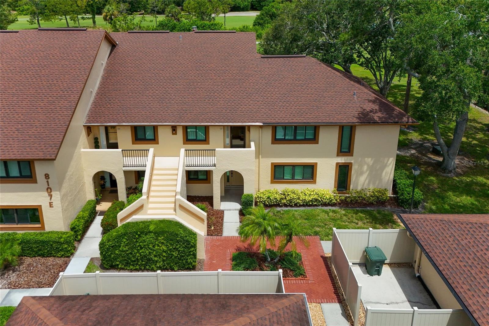 Aerial view of the home surrounded by trees