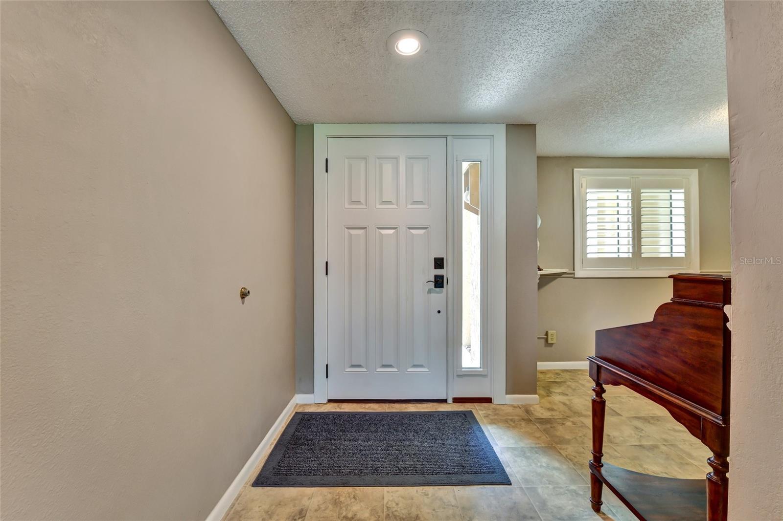 Beautiful front Door and side light was added in 2026 and is hurricane impact rated