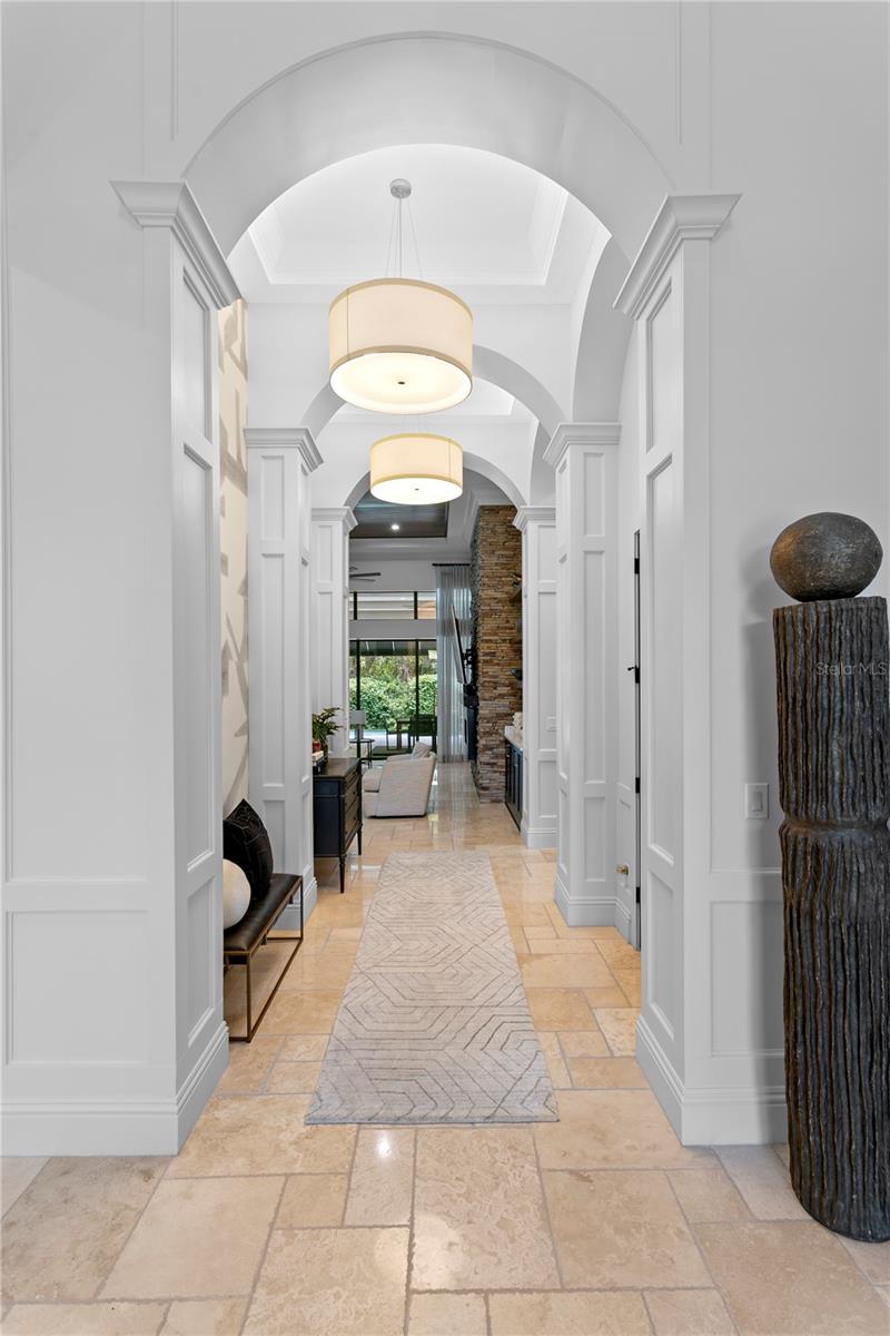 Dramatic ceiling treatments throughout.