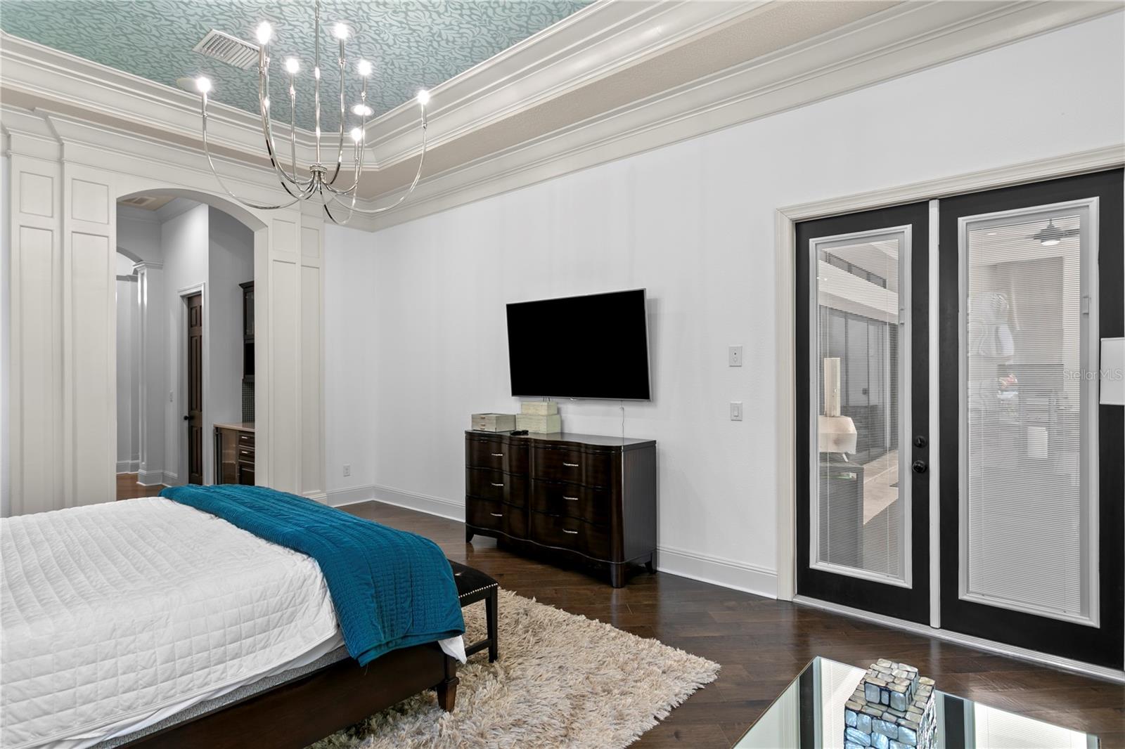 Spacious bedroom with elegant finishes.