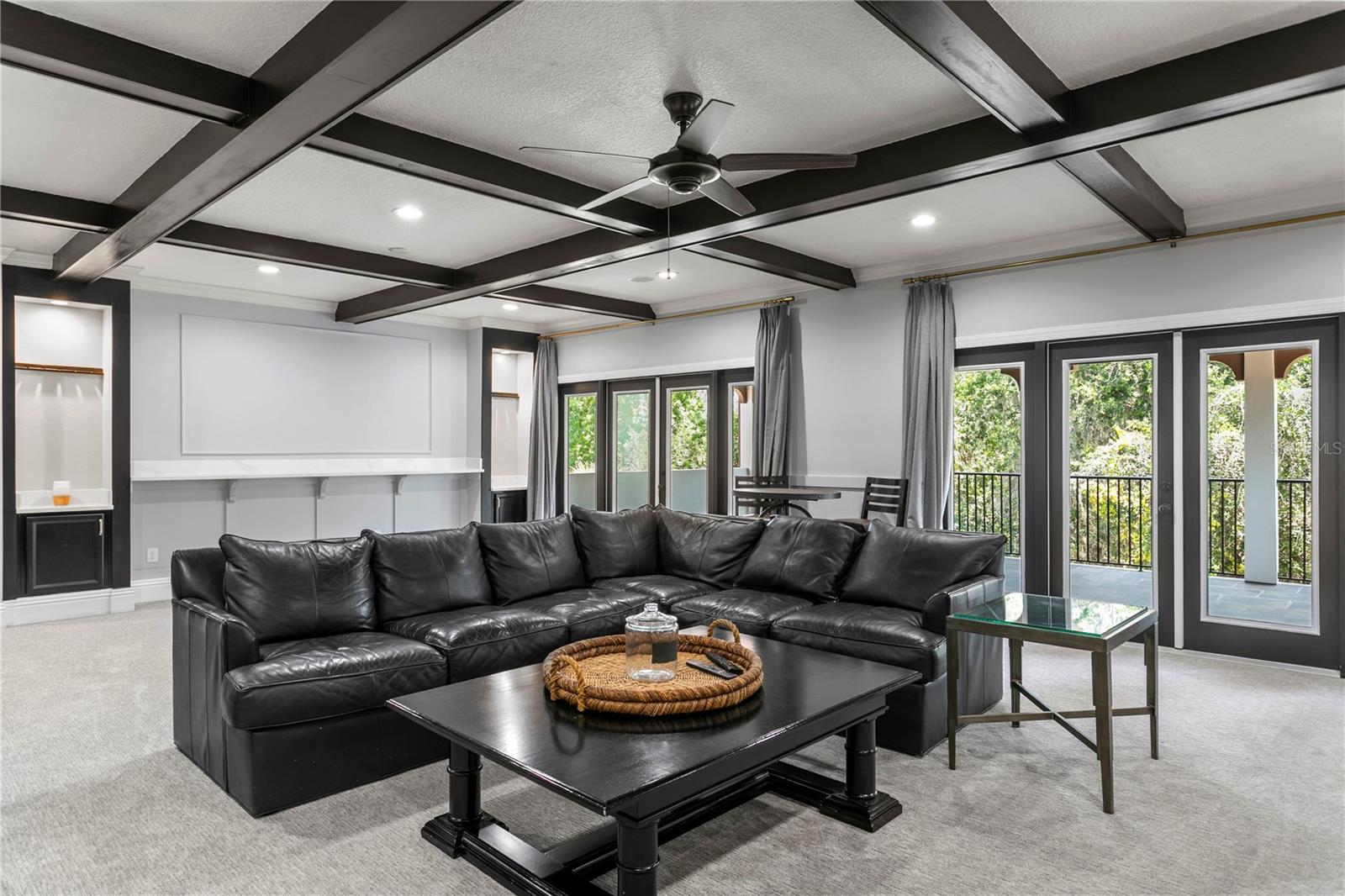 Alternate view of entertainment room with access to covered terrace.