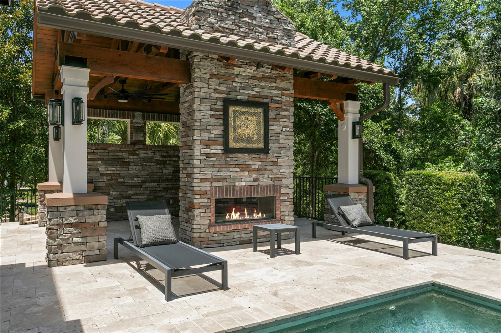 Covered cabana with fireplace.