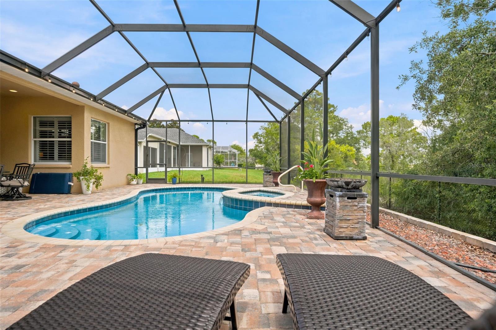 Large prick paver pool deck with screen enclosure!