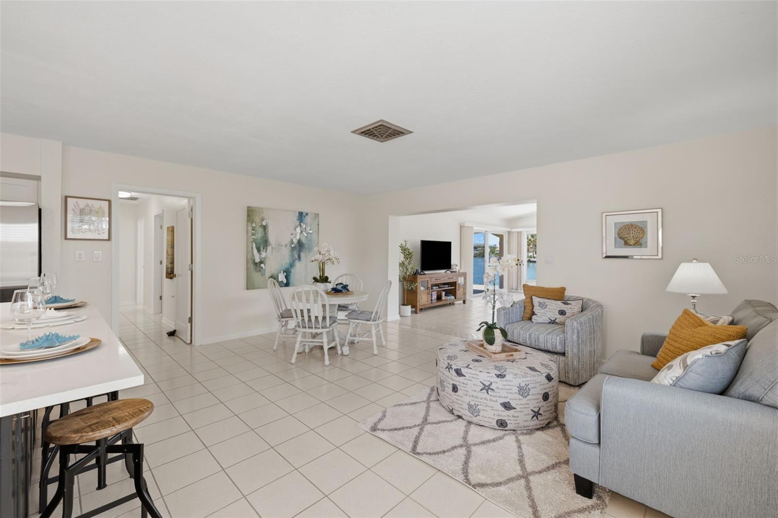 Enter into the kitchen, den and dining areas