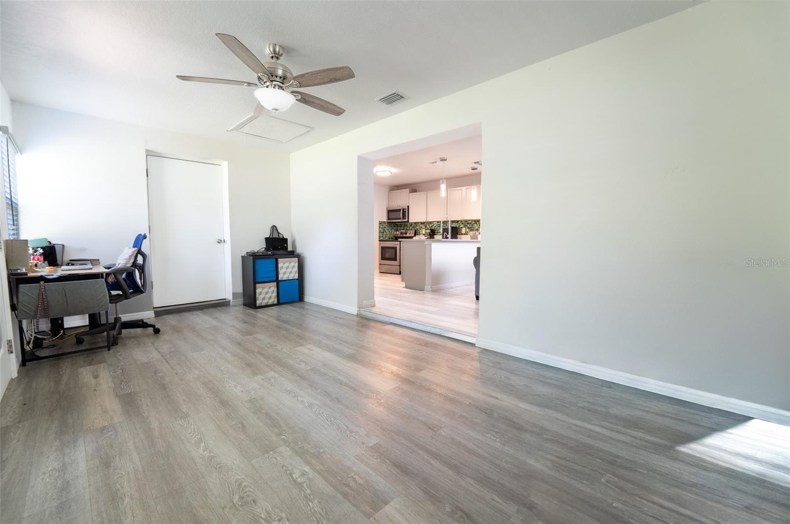 front room with laundry closet.