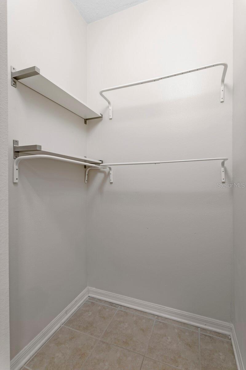 Primary bedroom walk in closet -2