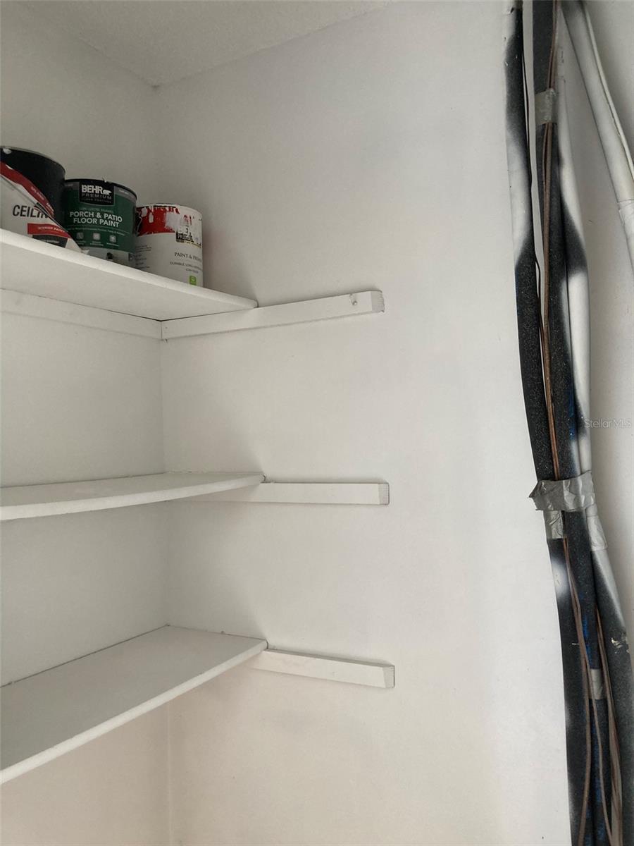 HVAC closet with shelves