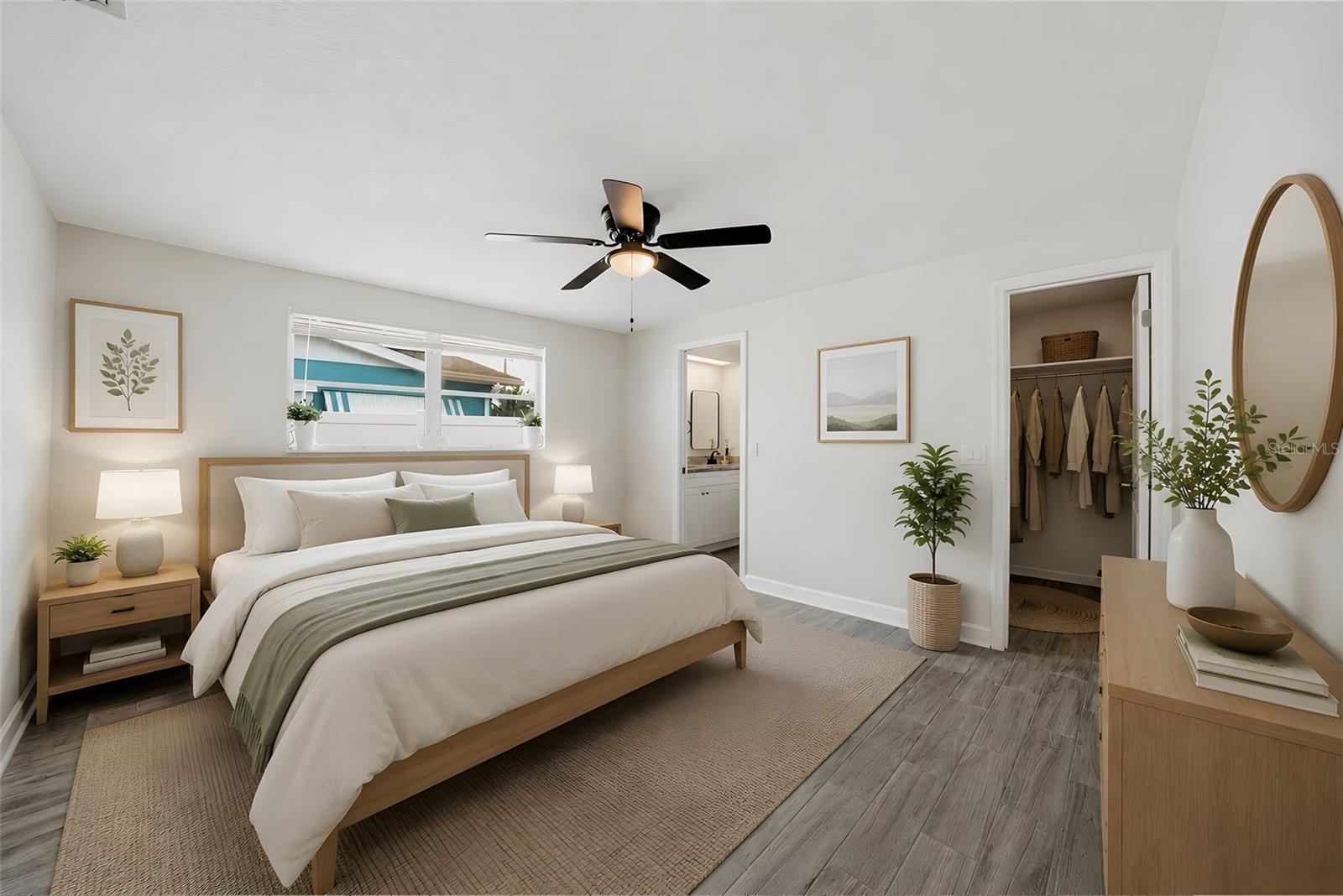 Primary bedroom with walk in closet