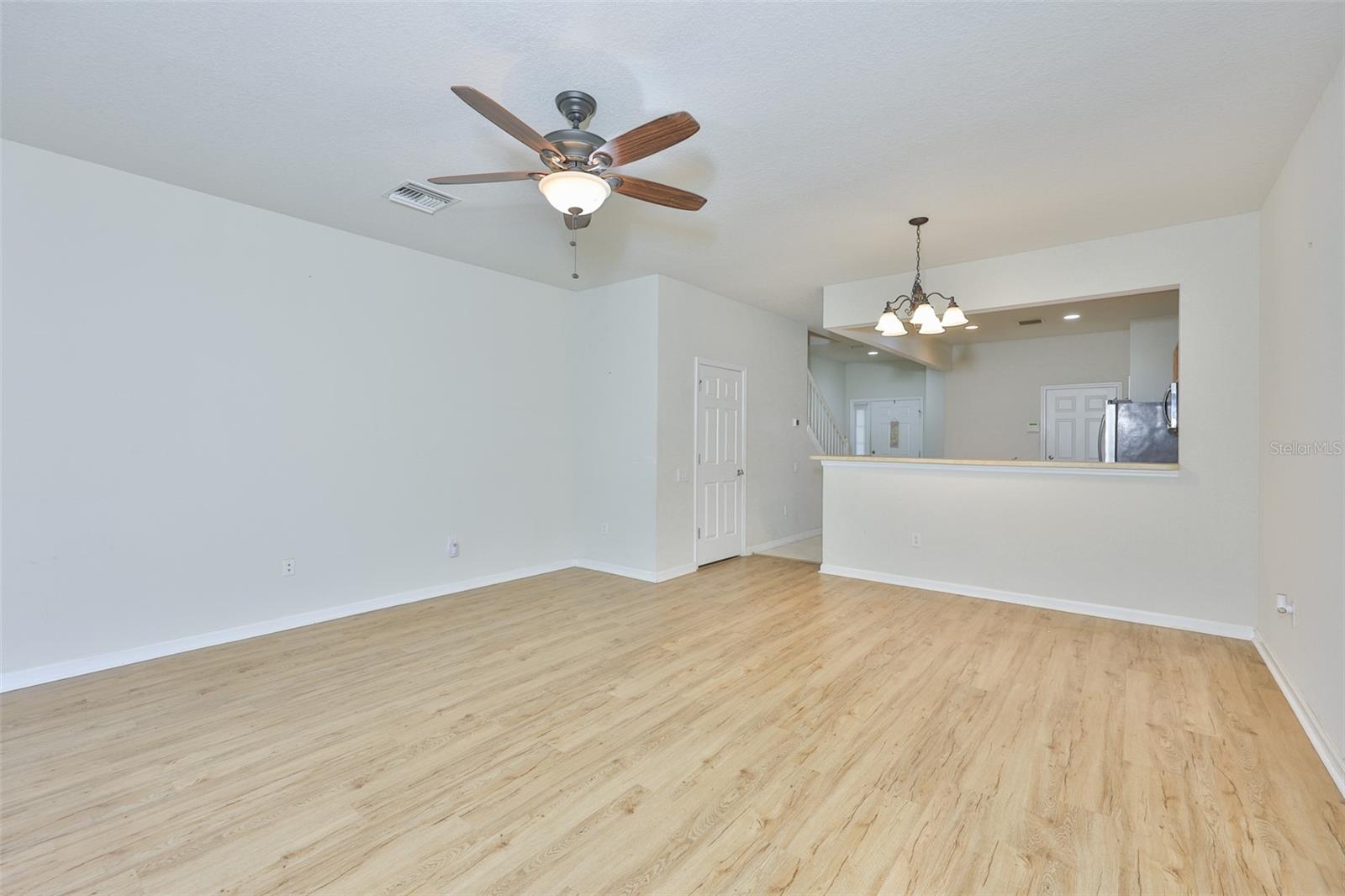 Great Room with Ceiling fan and light fixture for dining area