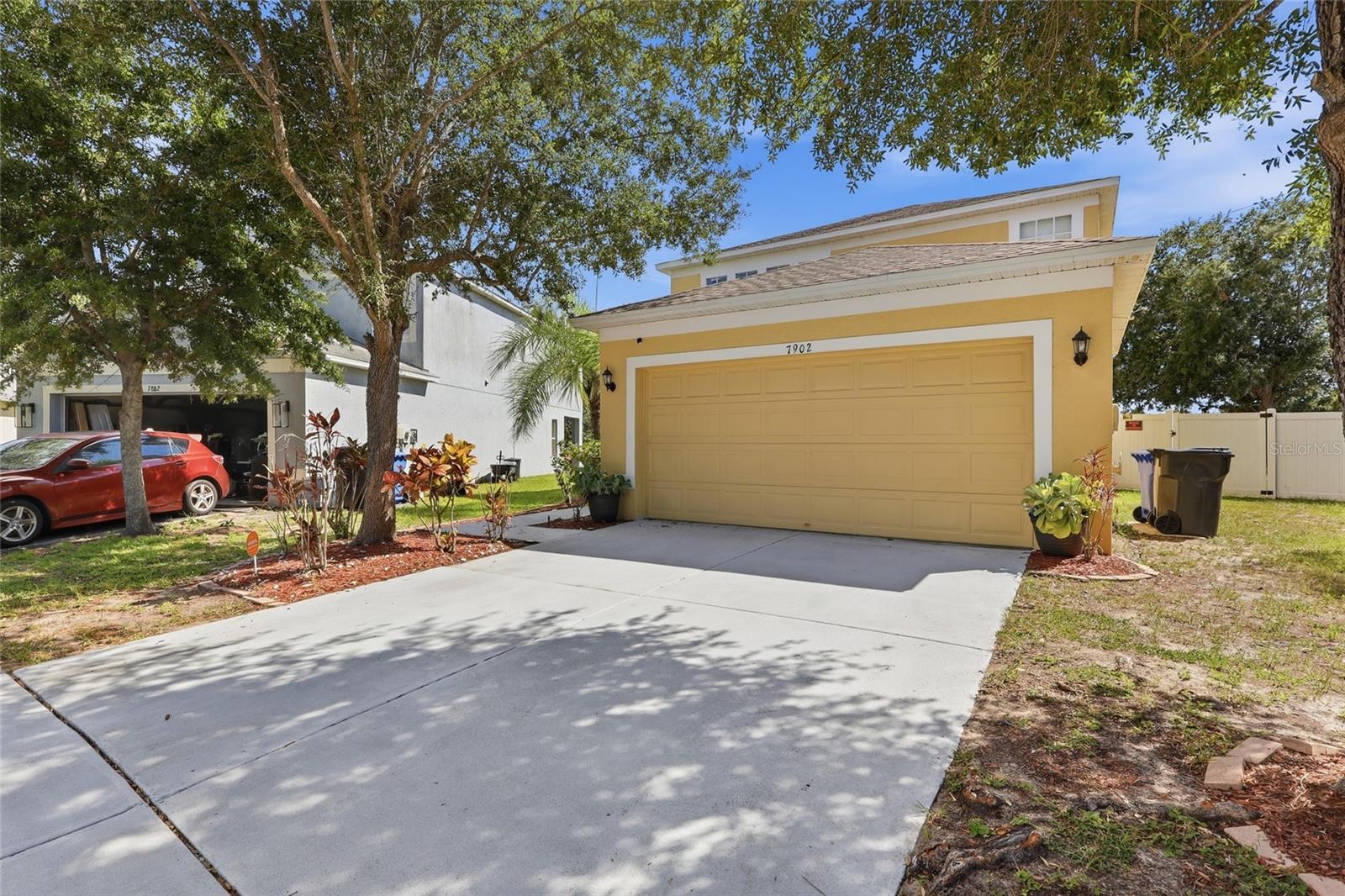 Florida single family home with 2-car garage and mature landscaping