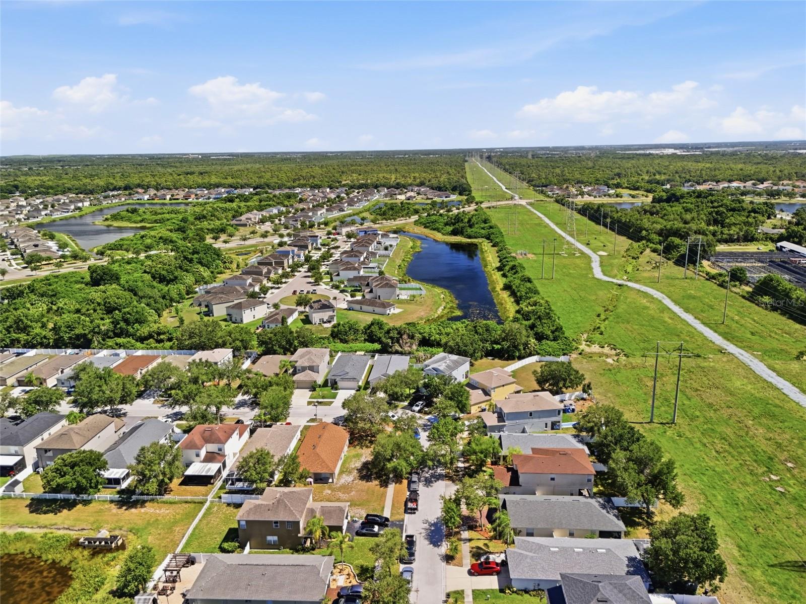 Aerial view of waterway community with conservation views and no rear neighbors