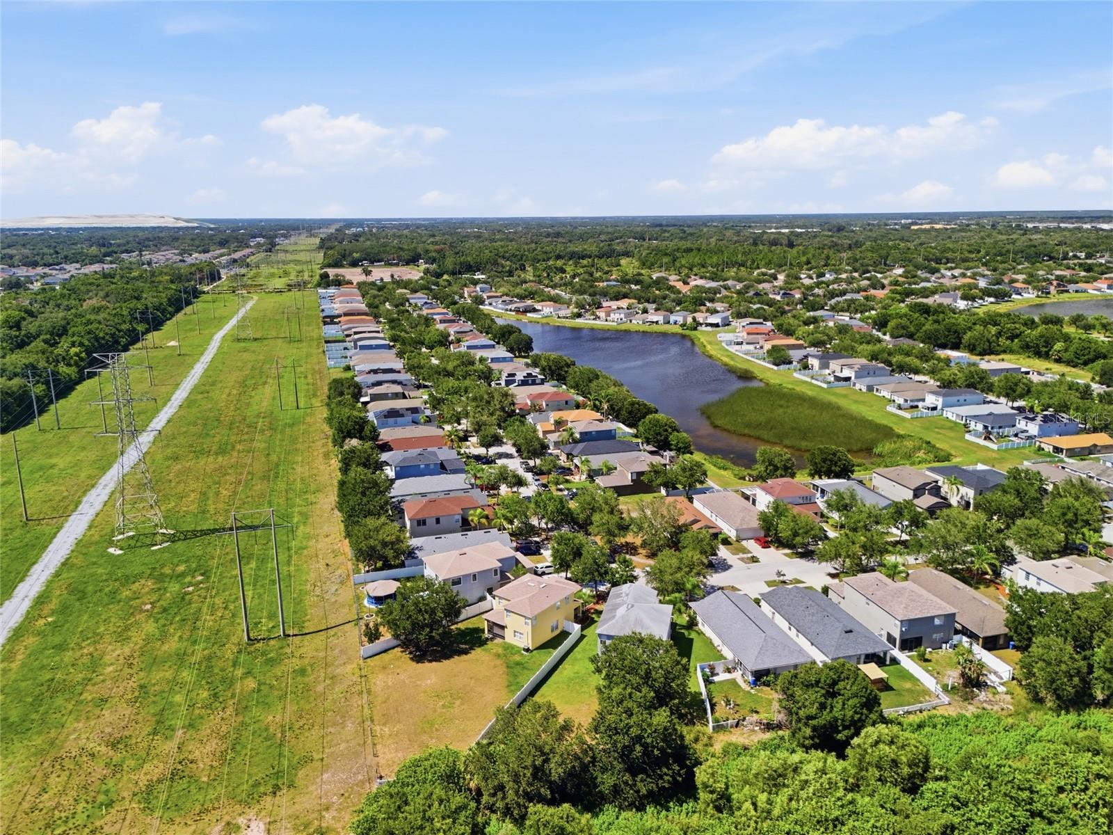 Aerial view of waterway community with conservation views and no rear neighbors