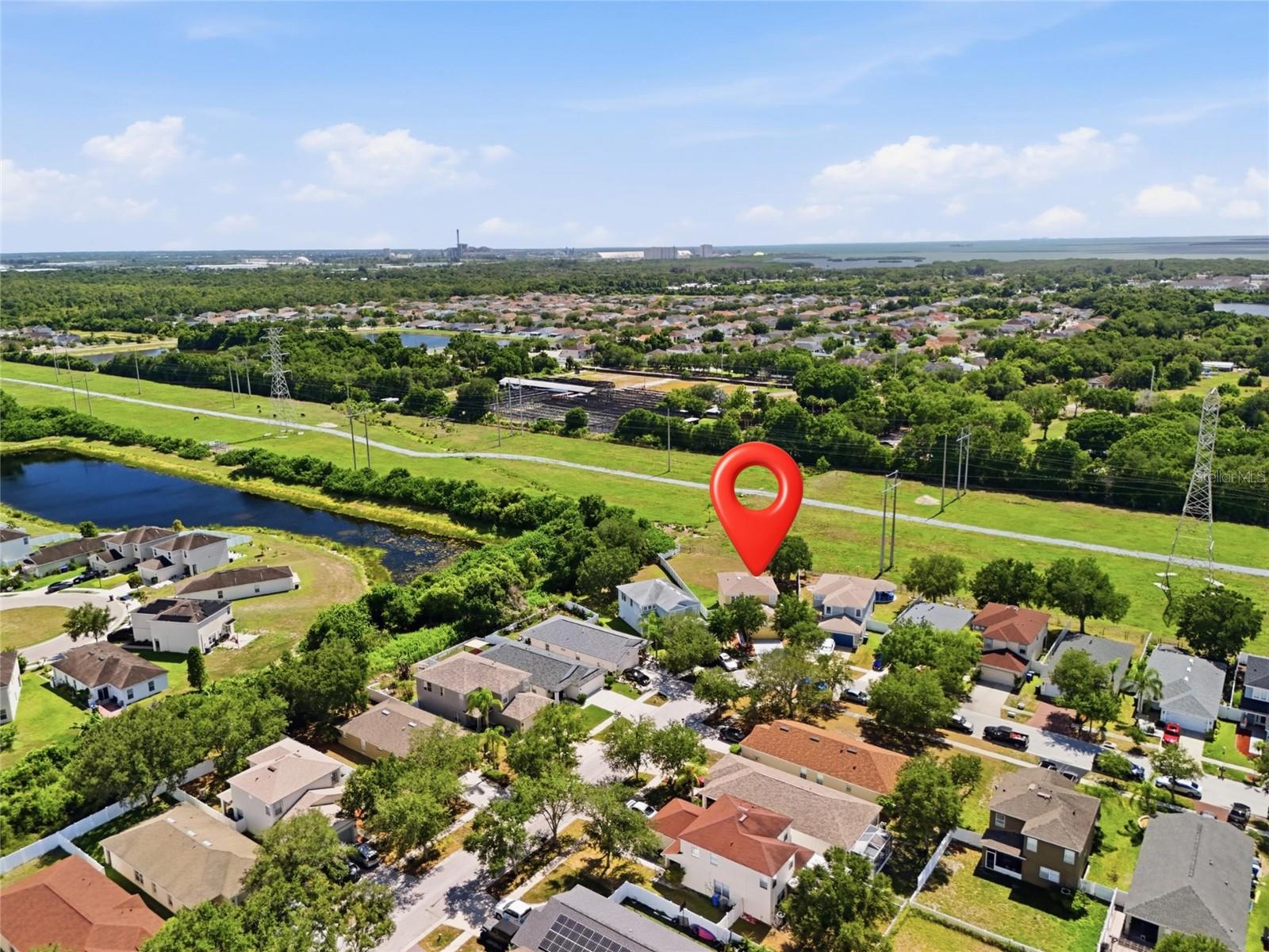 Aerial view of waterway community with conservation views and no rear neighbors